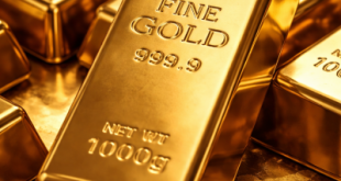 Close-up of 24K gold bullion bars representing financial security.