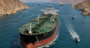Large commercial crude oil tanker navigating through narrow international shipping lanes.