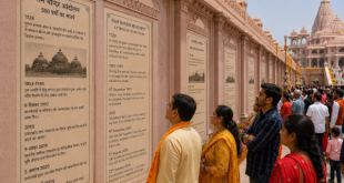 Devotees reading history plaques on the darshan route.
