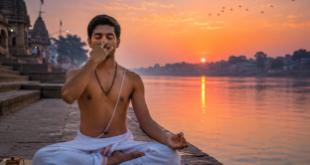 A serene practitioner sitting in a meditative cross-legged lotus posture at a riverbank during dawn twilight, performing morning yoga breathwork and meditation before sunrise.