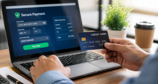 Close-up of an individual using a credit card to pay safely online via a laptop, illustrating financial planning.