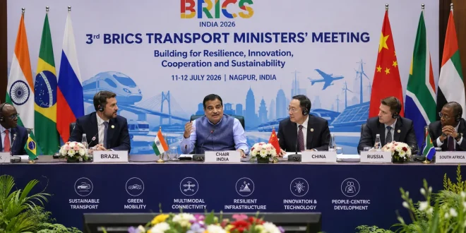 Union Minister Nitin Gadkari chairing the 3rd BRICS Transport Ministers Meeting in Nagpur India, flanked by international delegates, discussing sustainable transport infrastructure.
