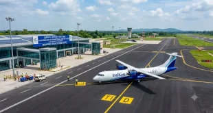 A commercial regional passenger aircraft taxiing on a newly constructed tarmac at a modernized Indian airport, illustrating infrastructure development under the Modified UDAN Scheme.