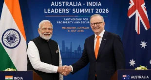 Prime Minister Narendra Modi and Australian Prime Minister Anthony Albanese shaking hands at the Australia-India Leaders Summit 2026 against official diplomatic backdrops.
