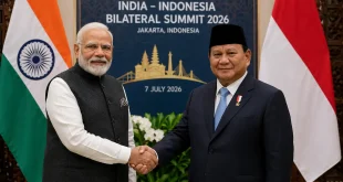 Indian Prime Minister Narendra Modi and Indonesian President Prabowo Subianto shaking hands in front of national flags during the 2026 bilateral summit in Jakarta, signifying an expanded strategic alliance.