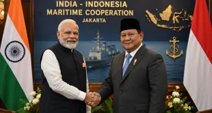 Prime Minister Narendra Modi shaking hands with Indonesian leadership, symbolizing bilateral maritime cooperation in Jakarta.