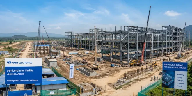 A panoramic view of the Tata Electronics semiconductor facility construction site at Jagiroad, Assam, showcasing industrial structural steel frames.