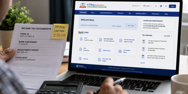 A close-up view of an individual checking financial documents alongside a laptop screen displaying the official Indian income tax e-filing dashboard.