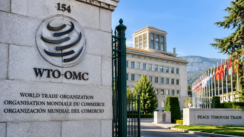 World Trade Organization headquarters entrance sign in Geneva representing multilateral trade governance.